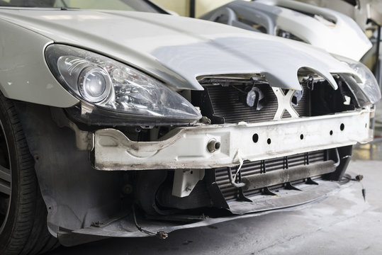 Auto body repair series : Closeup of white sport car waiting for repaint
