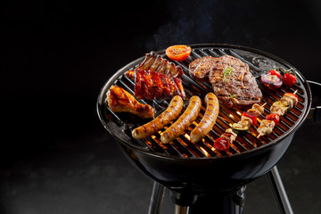 Assortment of marinated meat grilling on a BBQ - obrazy, fototapety, plakaty