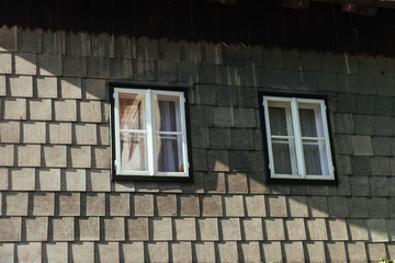 white window in the old wooden house.