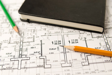 On the sheet of the drawing is a pencil with Notepad