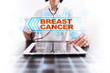 Medical doctor using tablet PC with breast cancer medical concept.