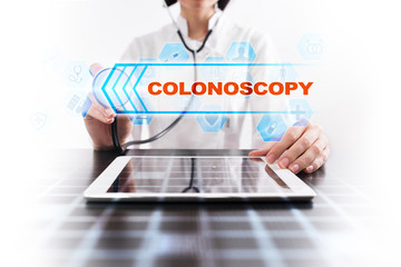 Medical doctor using tablet PC with colonoscopy medical concept.
