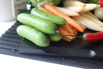 fresh vegetables and herbs, oregano, sage, chive, parsley, dill, onion, cucumber, green vegetables,  red vegetables, red pepper, pepper, garlic, cucumber, sweet corn, 