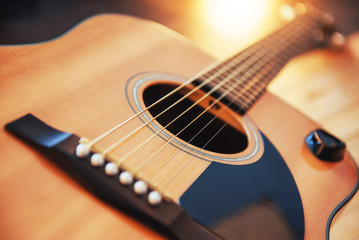 Fototapeta premium detail of classic guitar with shallow depth of field