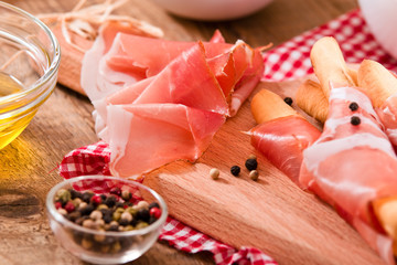 Grissini breadsticks with ham. 