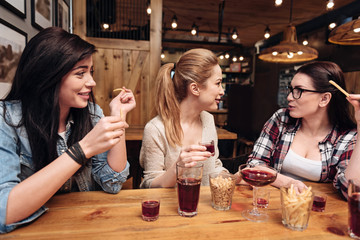 Delighted friends speaking to each other