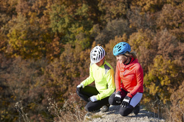 Mountain bikers relaxing at the hillside