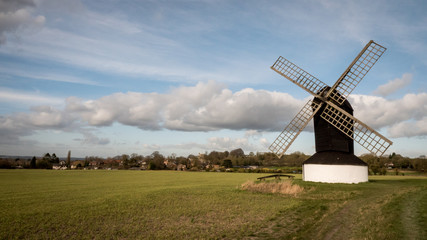 Fototapeta na wymiar Pitstone windmill, Buckinghamshire, England. A traditional old English windmill in a rural setting in the south of England.