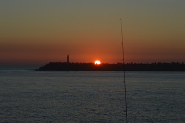 Pêcher au coucher de soleil