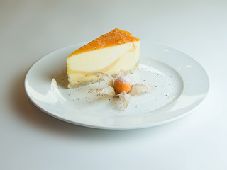 cheesecake with mango sauce, passion fruit