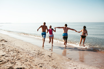 Friends on the beach. Have fun at sunny summer day