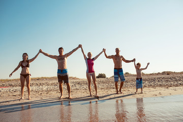 Friends on the beach. Have fun at sunny summer day