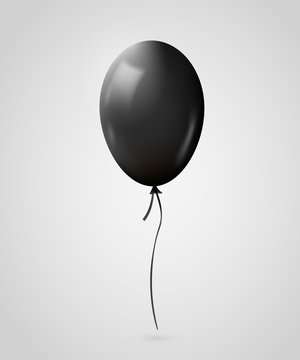 Realistic black balloon isolated on gray.
