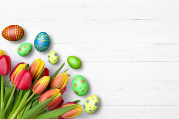 Ostereier mit Tulpen auf Holz / Ostern