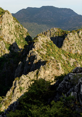 Steep rock mountains with high peak in the national park in Thailand.