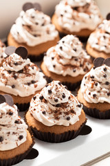 Coffee cupcakes with mocha buttercream and chocolate decorations