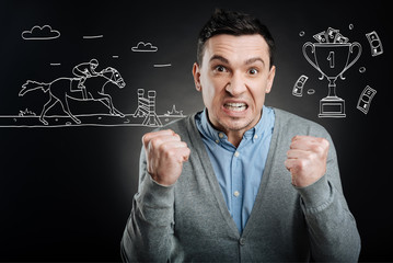 Emotional man watching horse race