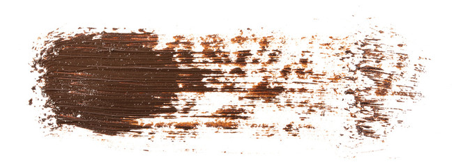 Smear of brown paint isolated on white background