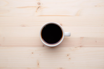 Coffee cup on wooden table