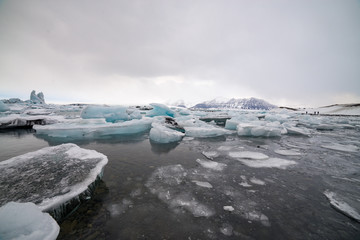 Piece of ice in Iceland, iceberg, black beach sand - March 2017