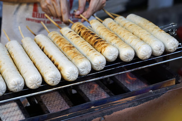 Sausages on grill, street fast food