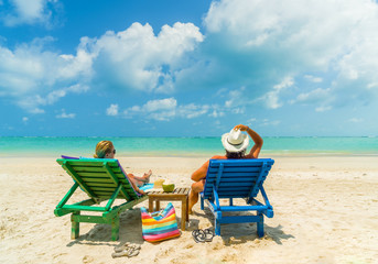 Couple on the beach at tropical resort Travel