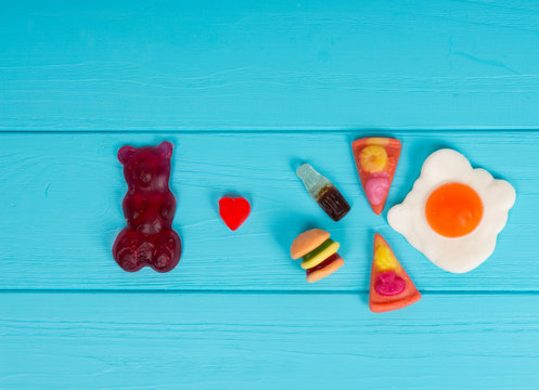 Jelly candies represent in the form of a burger, pizza and drink that gummy bear love it
