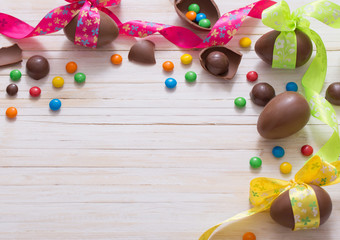 Chocolate Easter Eggs Over Wooden Background