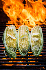 Fresh corn on grill with butter and salt