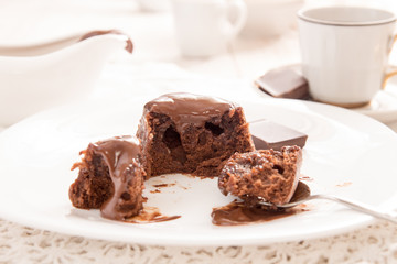 Chocolate french dessert cake mi-cuit on white plate