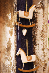 hanging decorative horses on the rustic wall