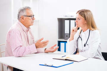 Patient is telling doctor about his health problems. 