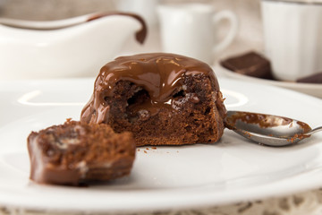 Chocolate french dessert cake mi-cuit on white plate
