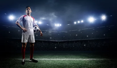 Foto auf Acrylglas Fußball Football player with ball on field of stadium