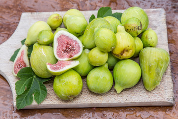 Ripe fig fruits on the wooden table.