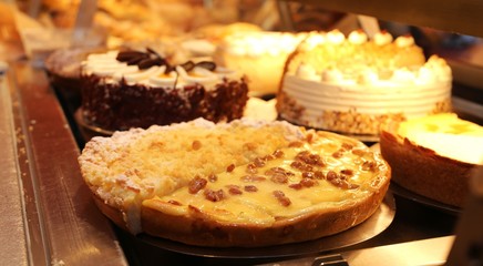 Baker counter with cakes. pies and rolls (close up)
