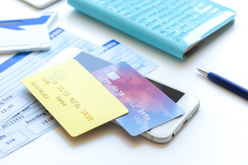 Credit cards with airline tickets for vacations on table background