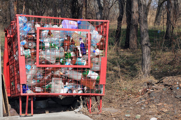 Dumpster for collection of plastic packaging.