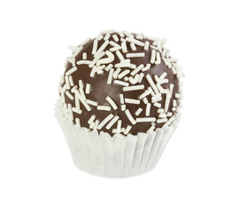 Chocolate cake ball with white sprinkles in paper form