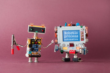 Robotic process automation industry 4.0 concept. IT specialist robot with pliers looking at...