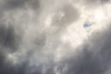 Dark clouds, through the shining rays of the sun