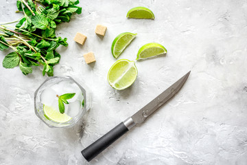 making mojito on stone background top view