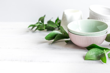 ceramic tableware with flowers on white background