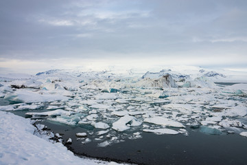 Piece of ice in Iceland, iceberg, black beach sand - March 2017