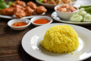 Muslim yellow rice with chicken on