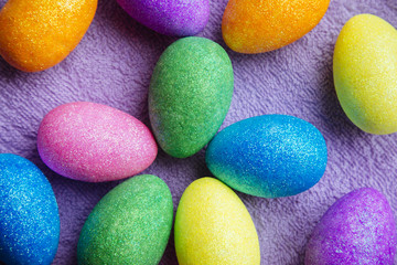 Colorful Easter Eggs on a fabric background. Creative concept