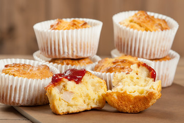 Homebaked Ham And Cheese Muffins In Paper Cases. Ketchup.