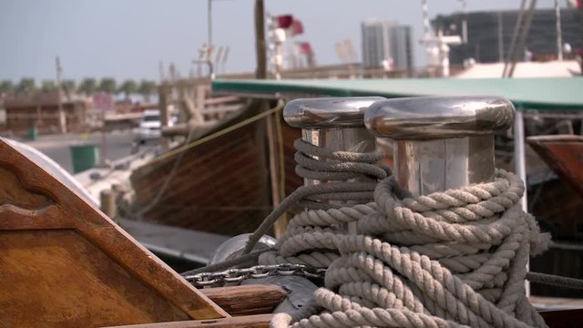 Detail of ropes on traditional dhow sailing vessel docked beside the Corniche in Doha, Qatar.