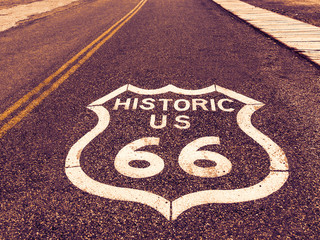 Historic US Route 66 highway sign on asphalt in Oatman, Arizona, United States. The picture was...