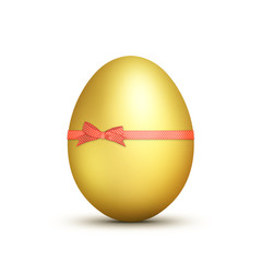 Gold Easter egg close up on a white background.